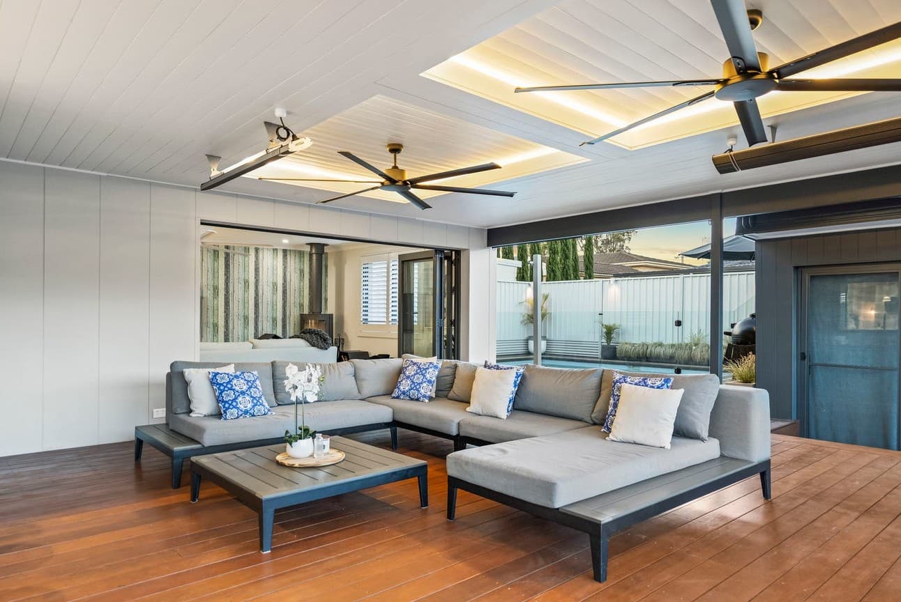 Modern outdoor entertaining area with integrated lighting by NS Electrics