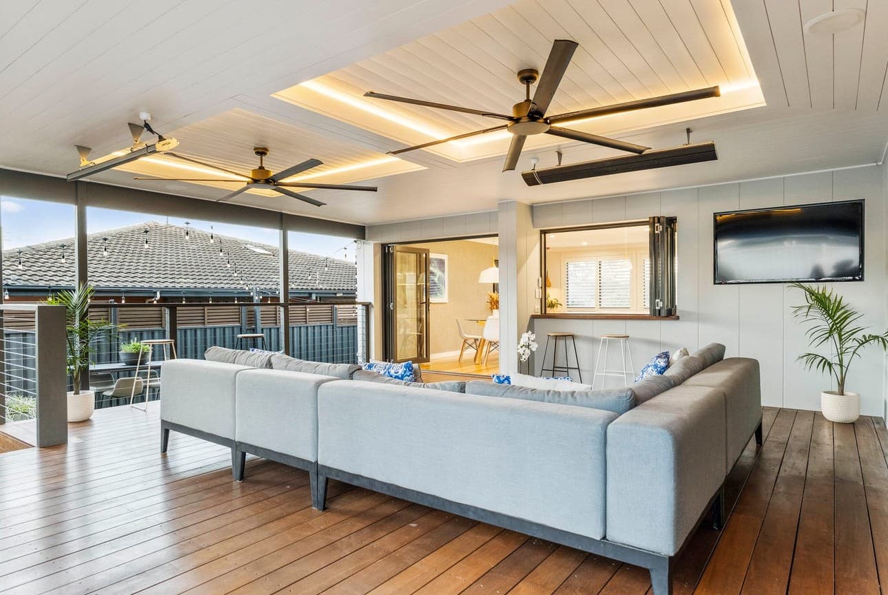 Modern pergola with multiple ceiling fans and integrated LED lighting